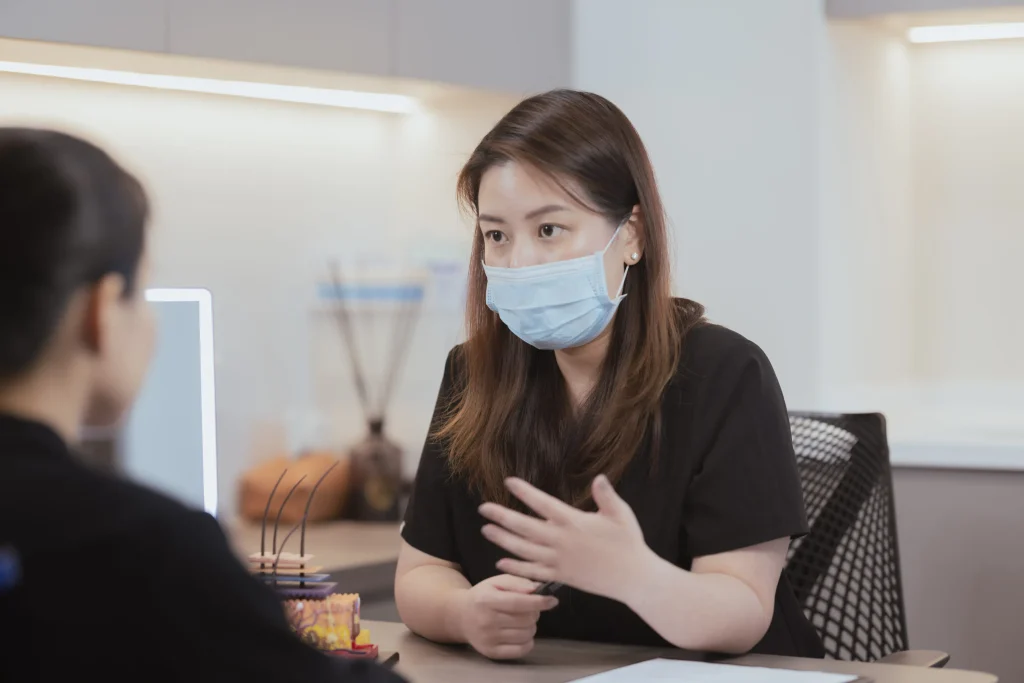 Doctor and patient discussing a treatment plan at Asimont Clinic