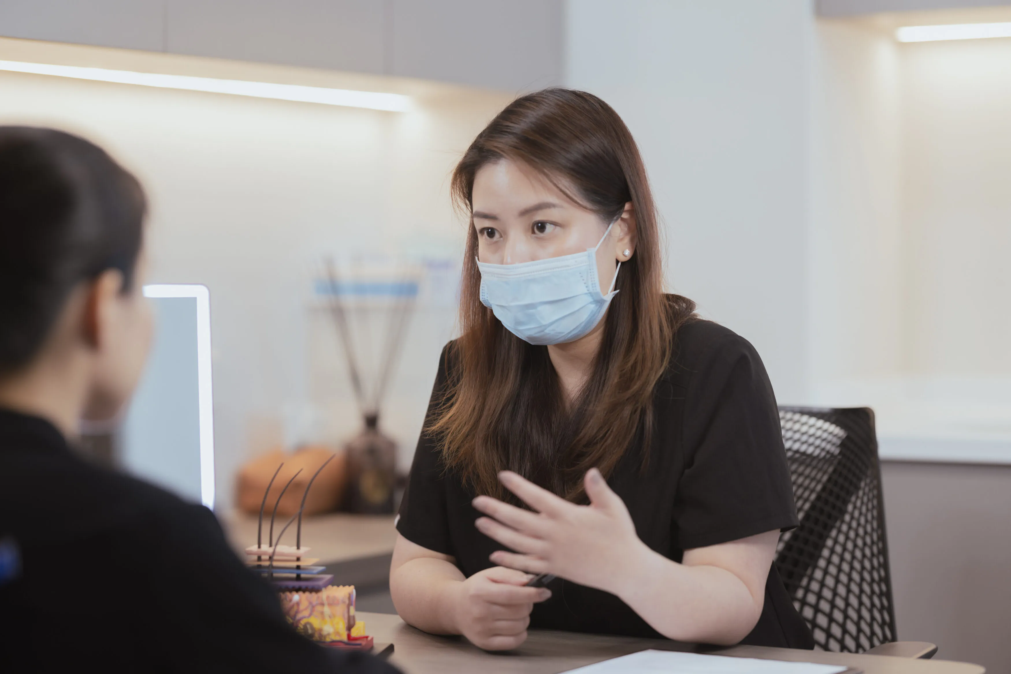 Doctor explaining Botox pricing and unit dosage during a consultation in Singapore